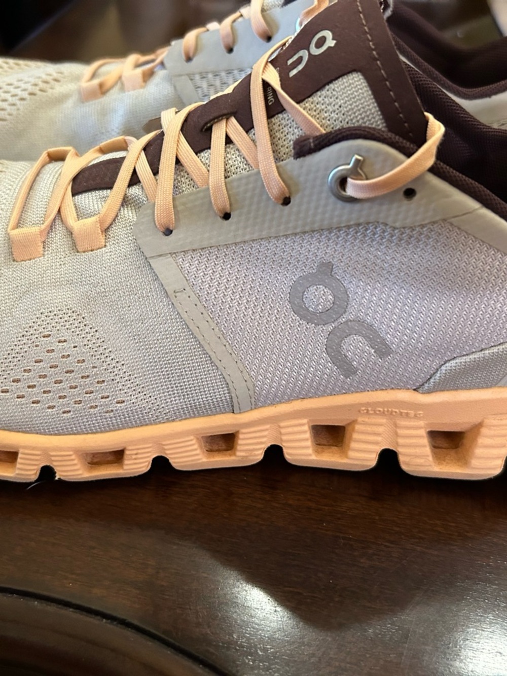 On Cloud Women’s Lightweight Peach and Light Gray Sneakers